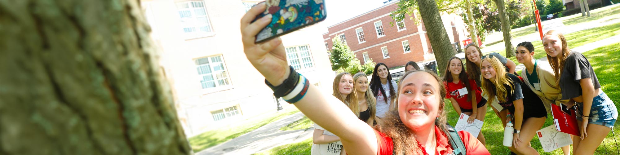 Orientation students pause for a group selfie