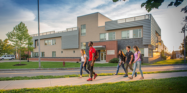 Students walking outside of the Professional Studies Building