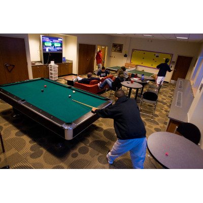 Students playing billiards
