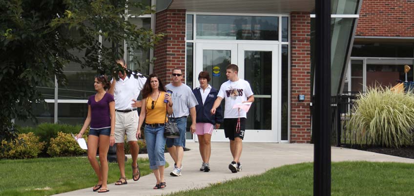 Parents and students walking on campus