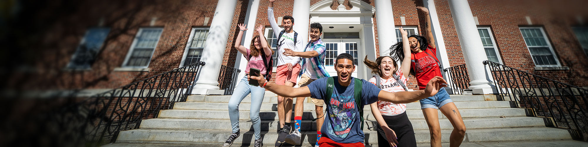Students jumping off Brockway Hall steps