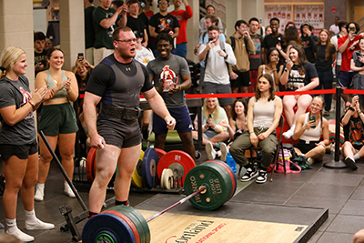 SUNY Cortland students attend a powerlifting meet in the Student Life Center