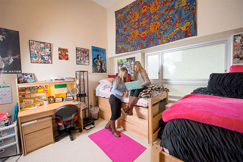 Two students in a bedroom in Dragon Hall