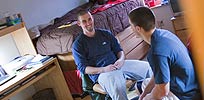 Guys hanging out in dorm room