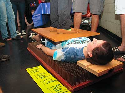Physics Club Demonstrates a bed of nails