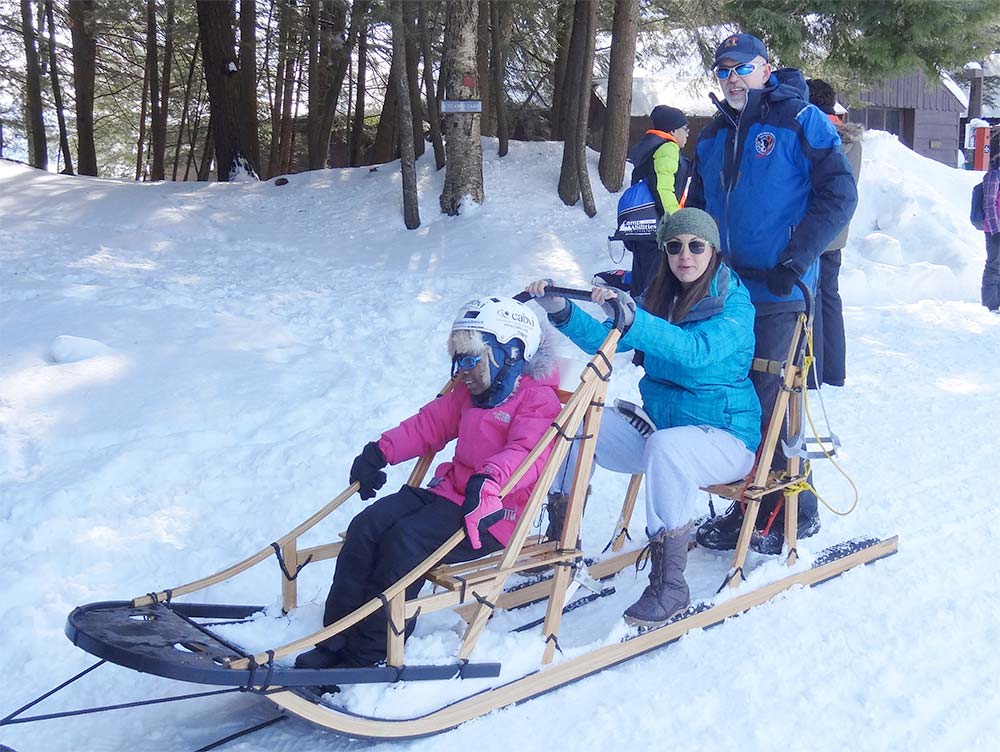 Close up of dog sled with participants