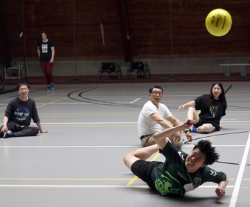 Students play adapted volleyball in Lusk Field House