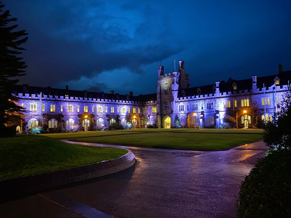 Night scene of the academic quad on campus of University College Cork, Ireland
