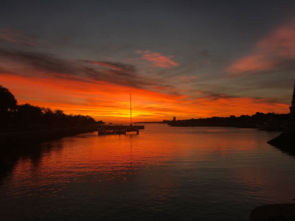 Sunset over the harbor in La Rochelle, France