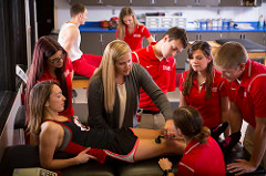 Athletic training students learn to treat an injury.