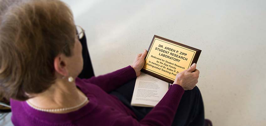 Kathryn Vernay holds Zipp plaque