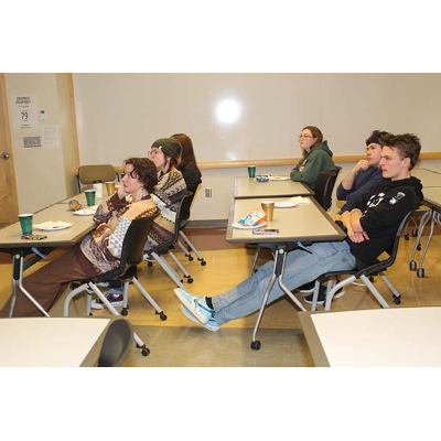 An absorbed Achaeology Club listens to their guest speaker