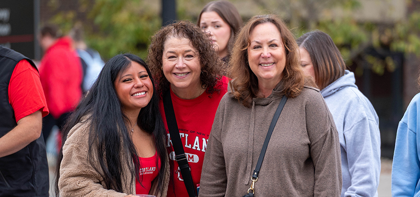 family smiling with student