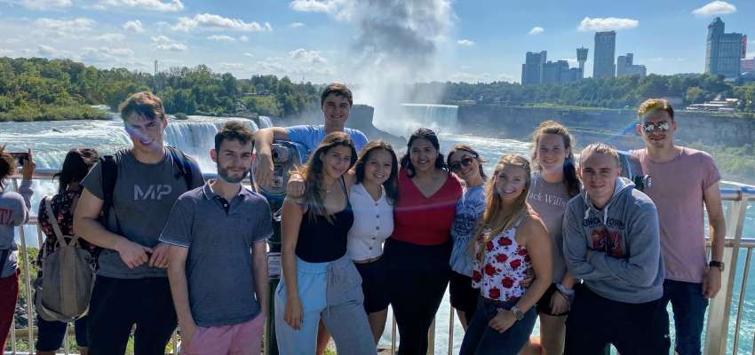 Students in front of Niagara Falls and skyline