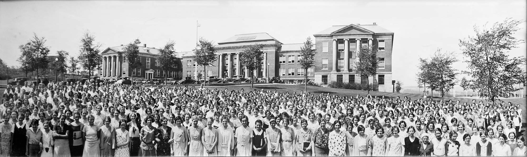 Old Commencement photo with graduates in front of Old Main