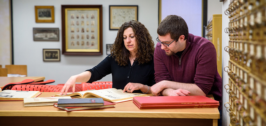 Associate Professor Laura Gathagan explores sources with a history student