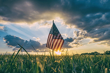 Flag_field_Aaron-Burden_Unsplash.gif