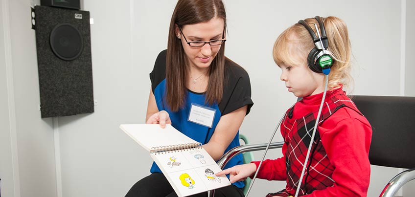 Local child getting a hearing screening