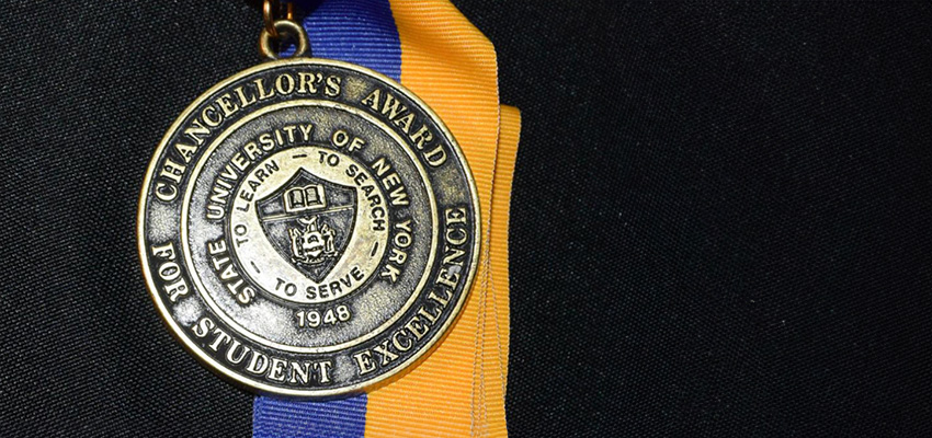 SUNY Chancellor's Award medal displayed on black background
