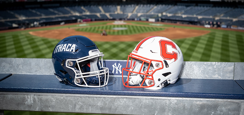 Cortaca Jug helmets side by side with Yankee Stadium field in the background