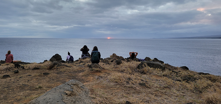 Students in ecotourism recreation course overlook a cliff in Hawaii