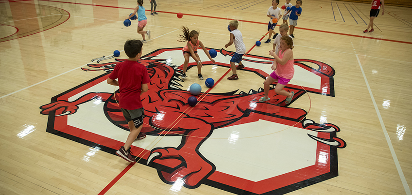 Students playing a game at a summer sport camp