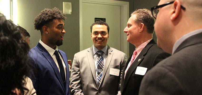 Students and employers at networking event