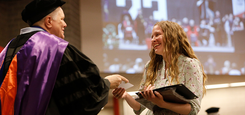 Student receives an award at Honors Convocation from Associate Professor Susan Wilson of the Recreation, Parks and Leisure Studies Department