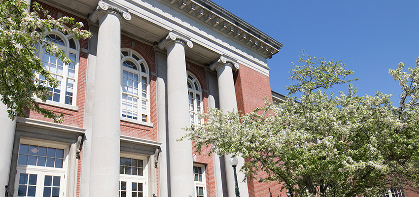 Exterior view of Old Main's columns in the spring