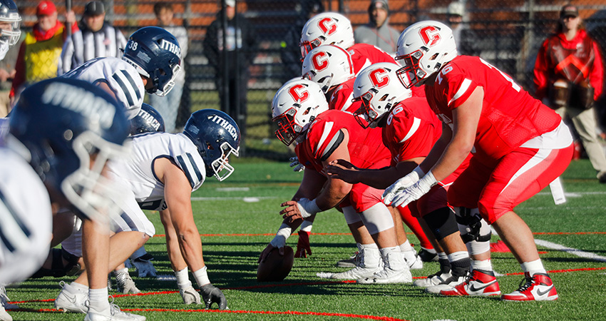 Cortland football offense lines up against Ithaca College at the SUNY Cortland Stadium Complex