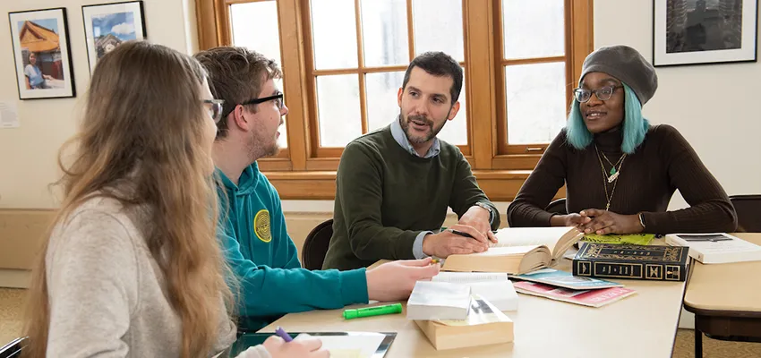 Graduate students class discussion with professor