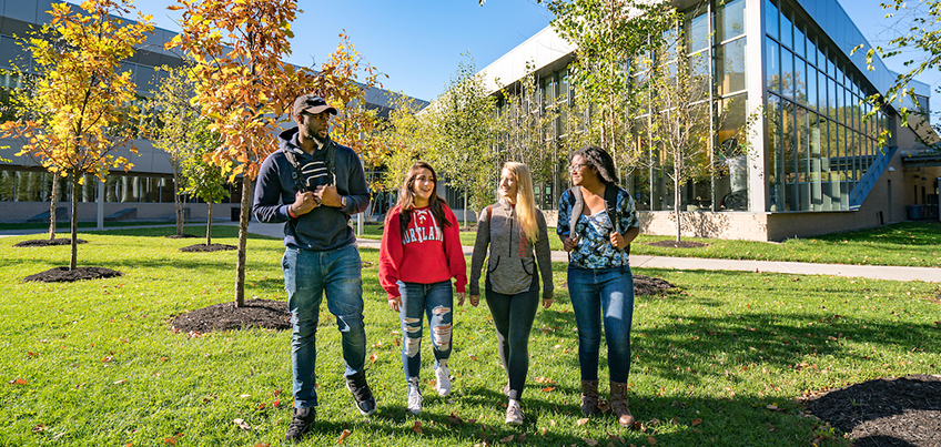 Students in a group outside of the Student Life Center