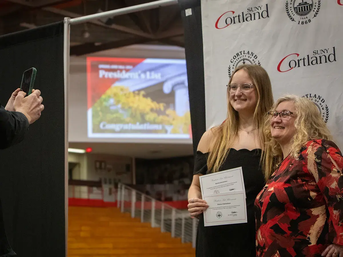 Mom and daughter pose at President's List ceremony