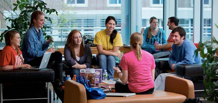 Students hanging out in the common room of Glass Tower Hall