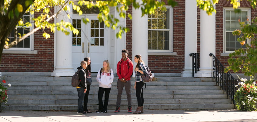 SUNY Cortland students meeting outside of Brockway Hall