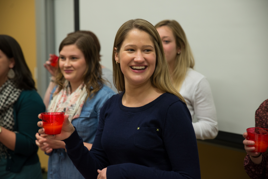 Graduate students participating in the thickened liquid challenge