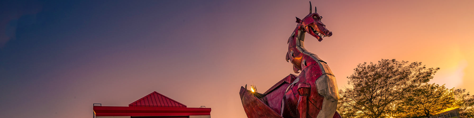 Red Dragon sculpture at sunset in spring