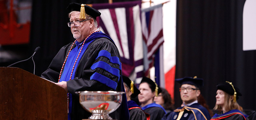 Professor speaking at commencement