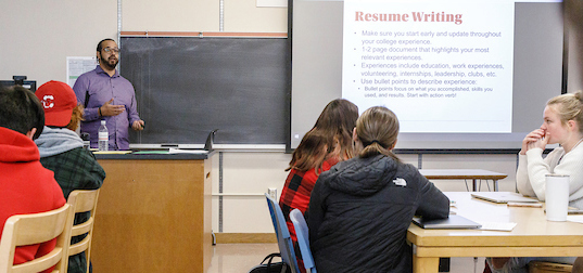 Career coach Jacob Wright presenting on resume writing in a class