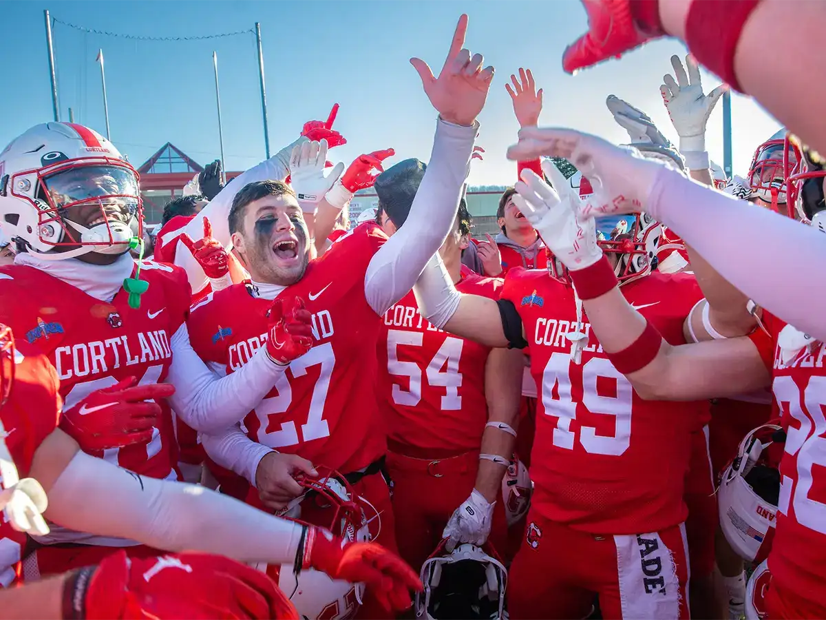Football team cheering victory