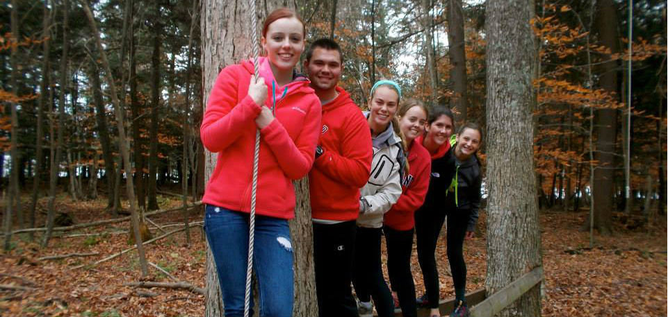Group of students on a ropes activity course