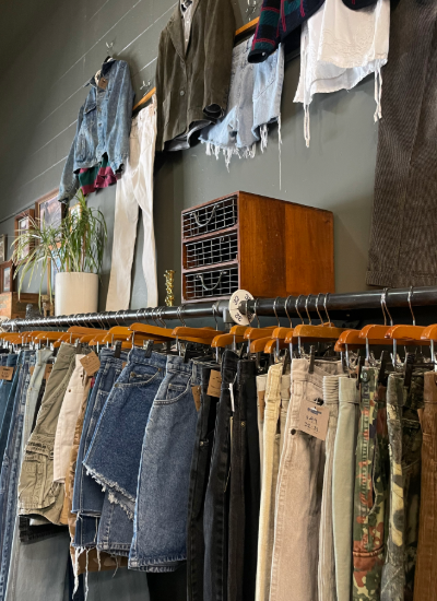 Clothing rack at Lot 1 Vintage, a secondhand store in the city of Cortland, photo taken by Rian Thomas