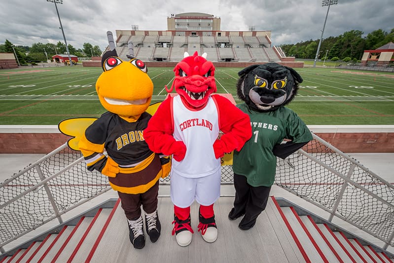 Blaze the Red Dragon standing next to other university mascots