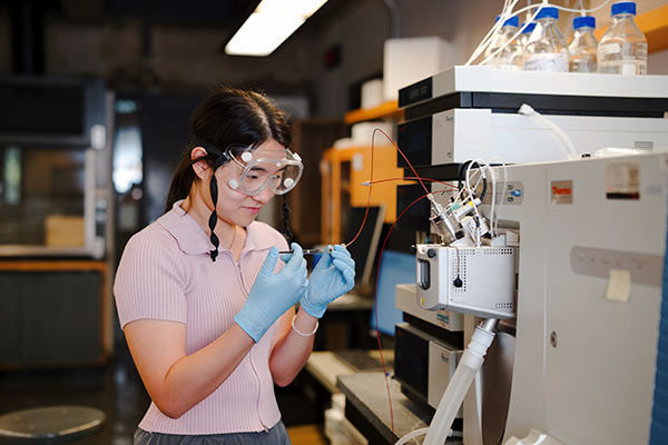 Student injecting sample into LC/MS