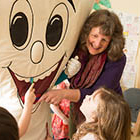 A health graduate student in the classroom with children