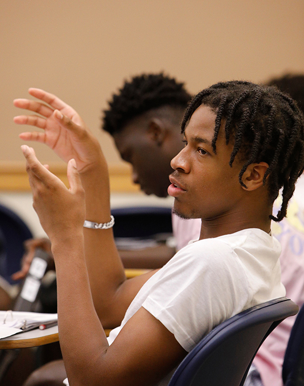 Ikenna Okoye speaks with his hands during class
