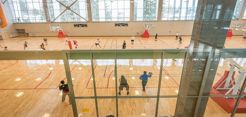 Students enjoying open recreation in 3 court gym