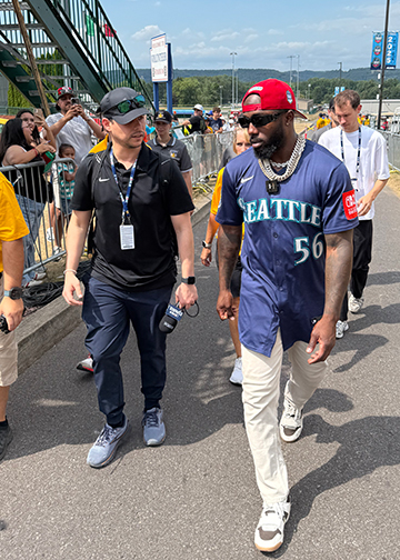 Javier Rom&aacute;n M &rsquo;14 (left) walks with the Seattle Mariners' Randy Arozarena at the Little League Classic in Williamsport, Pennsylvania.