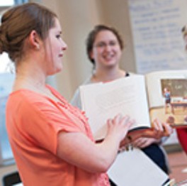 Literacy masters student reading to children