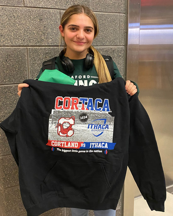 Alexa Villeck, winner of the Cortaca Sustainability Bingo challenge, posing with the prize.